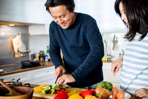 couple in kitchen cooking