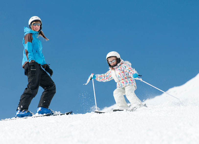 mother and child skiing